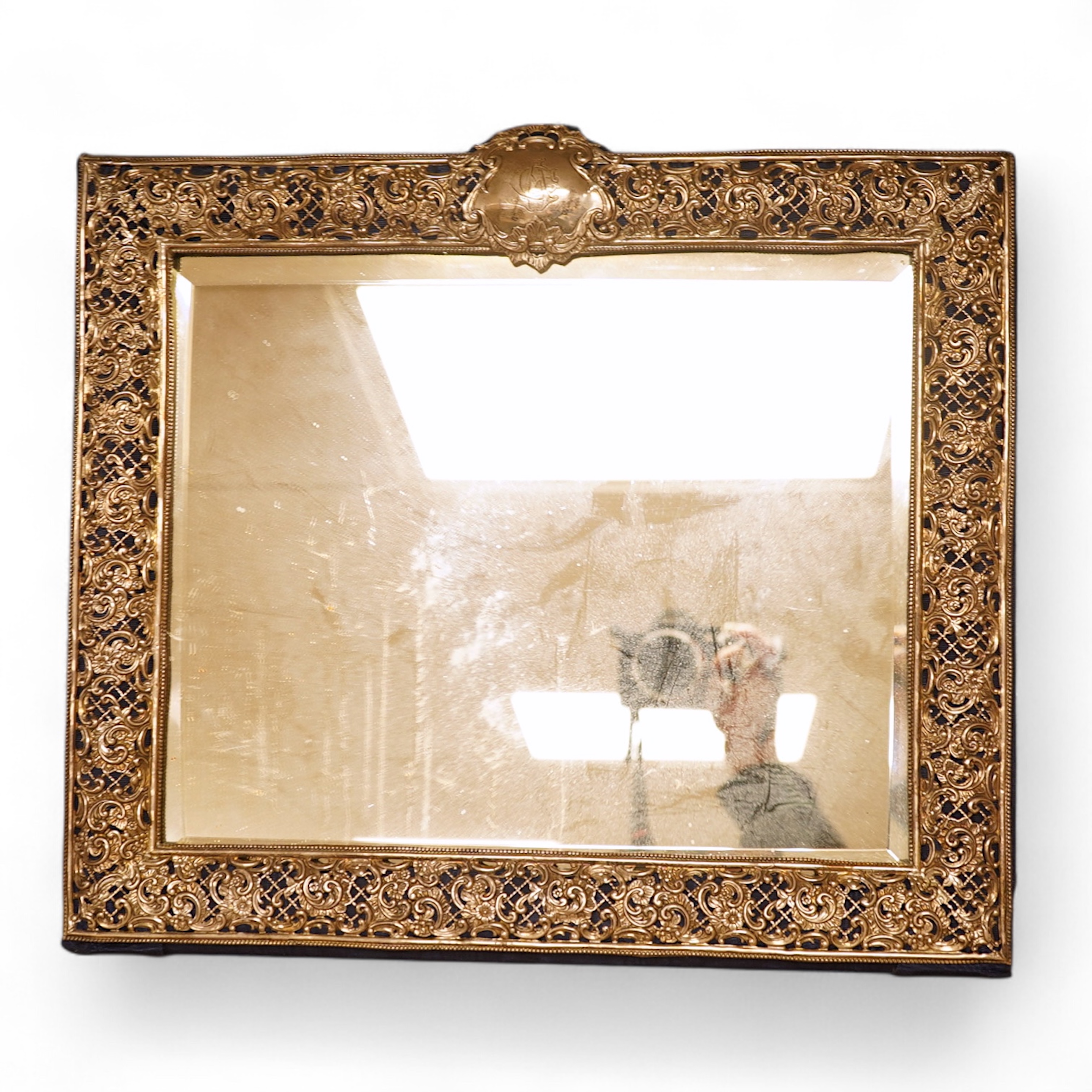 A large late Victorian repousse pierced silver mounted rectangular mirror, Henry Matthews, Birmingham, 1898, 37.4cm by 42.4cm.